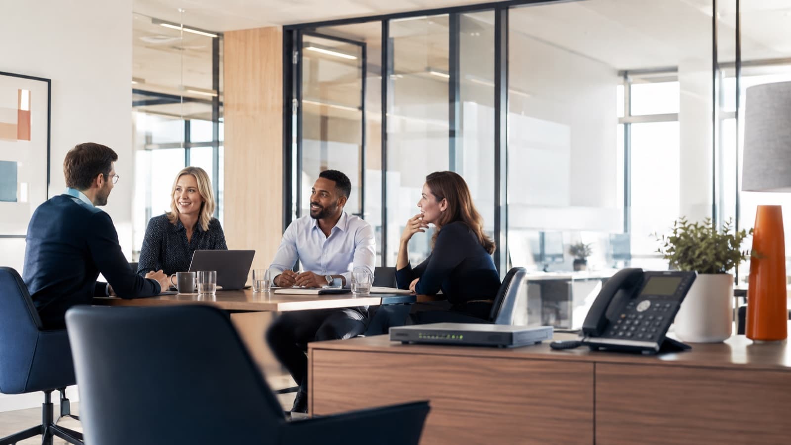 A business team using modern office connectivity and voice services