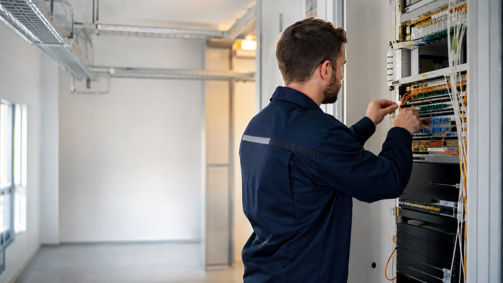 An engineer working on business network infrastructure